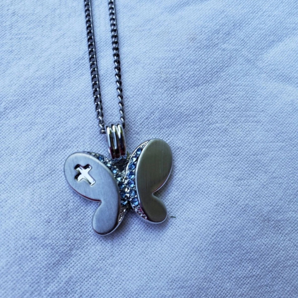 Brushed sterling silver butterfly necklace with white and light blue cz stones